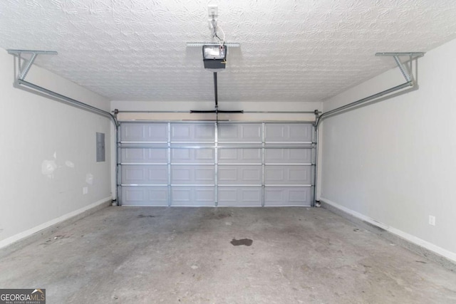 541 Shadow Valley Ct, Lithonia, GA 30058 - garage featuring baseboards and electric panel