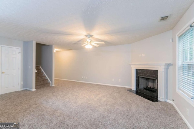 541 Shadow Valley Ct, Lithonia, GA 30058 - unfurnished living room featuring ceiling fan, carpet floors, stairs, a fireplace, and baseboards