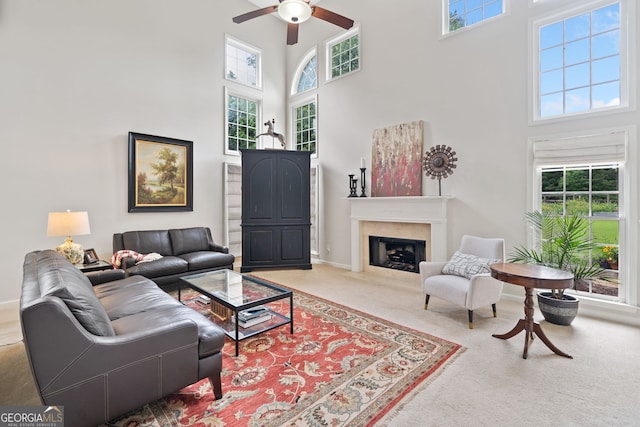 514 Augusta Dr, Canton, GA 30115 - living area with a high ceiling, carpet floors, ceiling fan, a high end fireplace, and baseboards