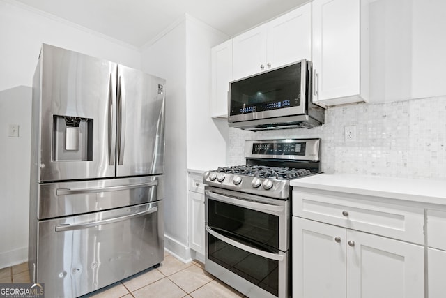 1844 Stanton St, Decatur, GA 30032 - kitchen with stainless steel appliances, light countertops, white cabinets, crown molding, and light tile patterned flooring