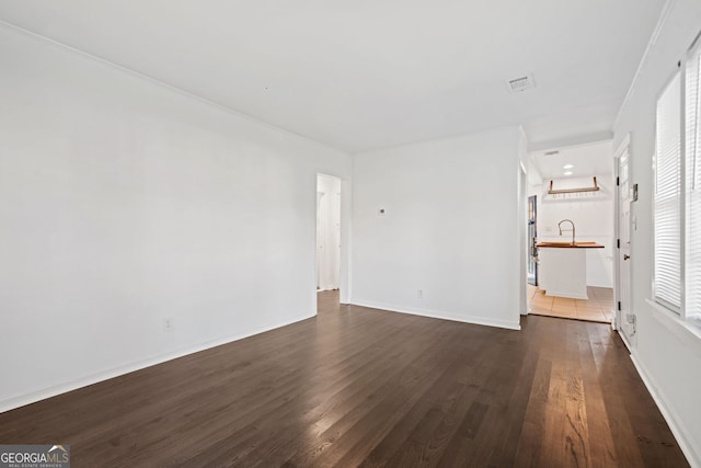 1844 Stanton St, Decatur, GA 30032 - empty room featuring dark wood finished floors, a sink, and baseboards
