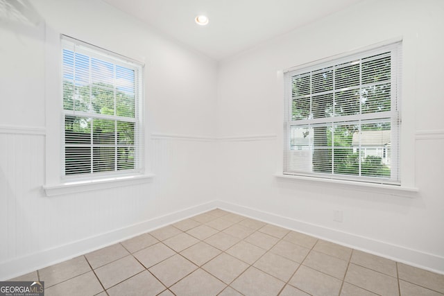 1844 Stanton St, Decatur, GA 30032 - unfurnished room with wainscoting, light tile patterned flooring, and baseboards