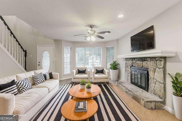 5352 Windfern Ct, Stone Mountain, GA 30088 - living room with stairway, baseboards, a ceiling fan, a stone fireplace, and recessed lighting