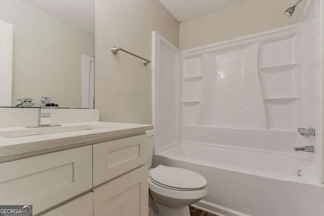 5352 Windfern Ct, Stone Mountain, GA 30088 - full bathroom with shower / washtub combination, vanity, toilet, and a textured ceiling