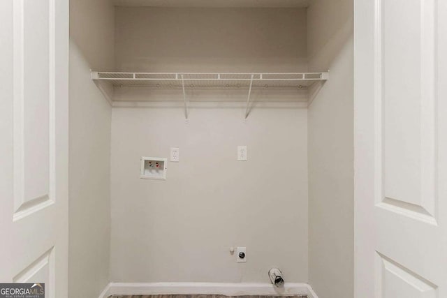 5352 Windfern Ct, Stone Mountain, GA 30088 - laundry area with hookup for an electric dryer, hookup for a washing machine, and baseboards