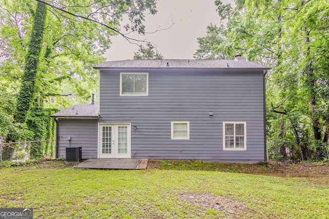 5352 Windfern Ct, Stone Mountain, GA 30088 - back of house featuring french doors, a chimney, a patio area, and central AC