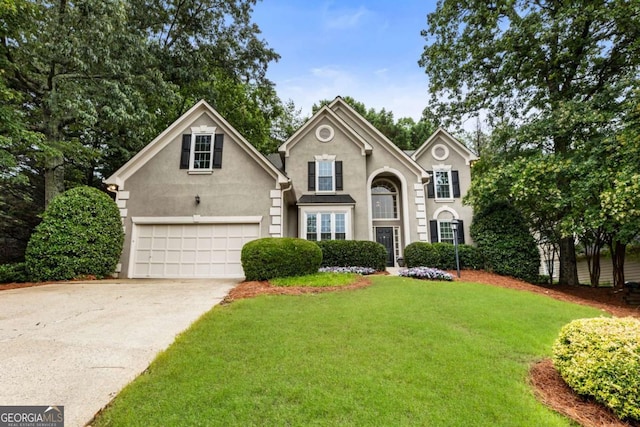 5860 Fairway View Dr, Suwanee, GA 30024 - traditional home with driveway, stucco siding, a front yard, and an attached garage
