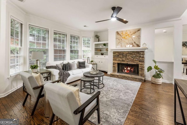 5860 Fairway View Dr, Suwanee, GA 30024 - living room featuring crown molding, ceiling fan, plenty of natural light, wood-type flooring, and a fireplace