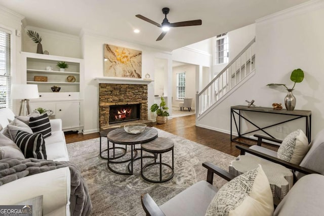 5860 Fairway View Dr, Suwanee, GA 30024 - living room with ceiling fan, crown molding, wood finished floors, stairway, and a stone fireplace
