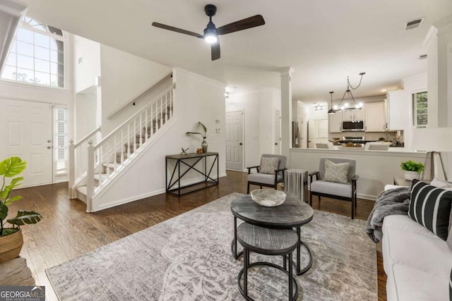 5860 Fairway View Dr, Suwanee, GA 30024 - living area with stairs, plenty of natural light, a ceiling fan, and wood finished floors