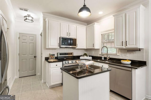 5860 Fairway View Dr, Suwanee, GA 30024 - kitchen with stainless steel appliances, white cabinetry, dark countertops, and ornamental molding