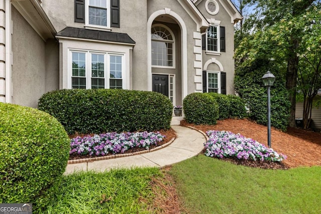5860 Fairway View Dr, Suwanee, GA 30024 - view of exterior entry with stucco siding