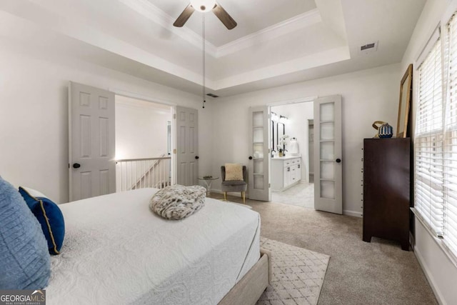 5860 Fairway View Dr, Suwanee, GA 30024 - carpeted bedroom with a tray ceiling, ensuite bathroom, a ceiling fan, and crown molding