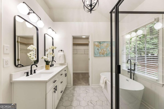 5860 Fairway View Dr, Suwanee, GA 30024 - full bathroom featuring a spacious closet, double vanity, a soaking tub, and plenty of natural light