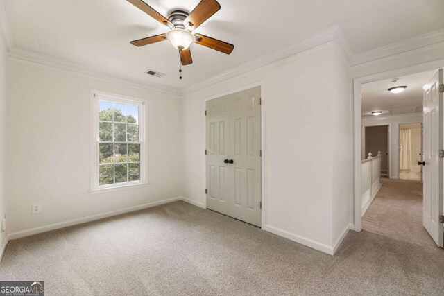 5860 Fairway View Dr, Suwanee, GA 30024 - unfurnished bedroom with carpet flooring, crown molding, ceiling fan, and a closet
