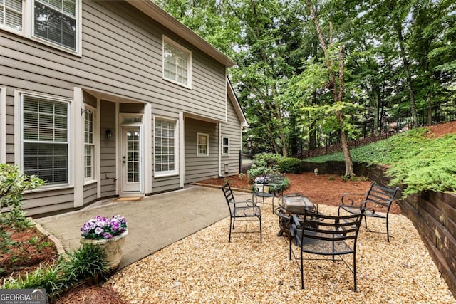 5860 Fairway View Dr, Suwanee, GA 30024 - view of patio featuring a fire pit