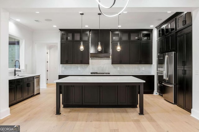 1050 Carnoustie, Greensboro, GA 30642 - kitchen featuring stainless steel appliances, backsplash, light wood-style flooring, glass insert cabinets, and recessed lighting