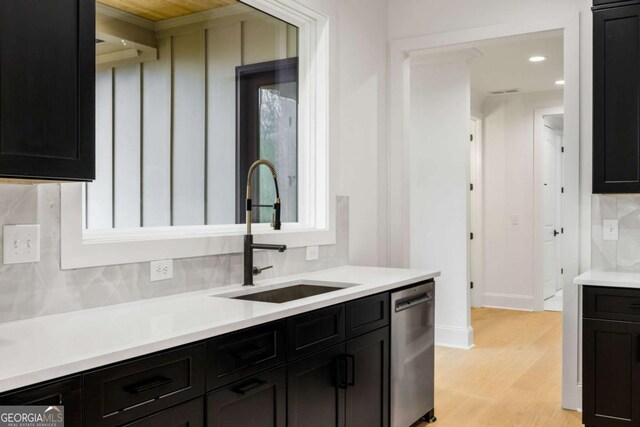 1050 Carnoustie, Greensboro, GA 30642 - kitchen with dishwasher, tasteful backsplash, light wood-style floors, light countertops, and recessed lighting