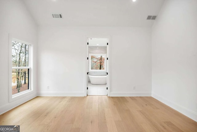 1050 Carnoustie, Greensboro, GA 30642 - empty room with light wood finished floors and recessed lighting