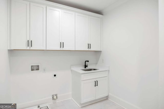 1050 Carnoustie, Greensboro, GA 30642 - laundry room with hookup for a washing machine, cabinet space, and electric dryer hookup