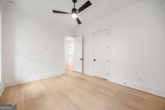 1050 Carnoustie, Greensboro, GA 30642 - unfurnished bedroom with light wood finished floors, crown molding, and ceiling fan
