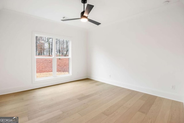1050 Carnoustie, Greensboro, GA 30642 - empty room with light wood-style flooring, a ceiling fan, and crown molding