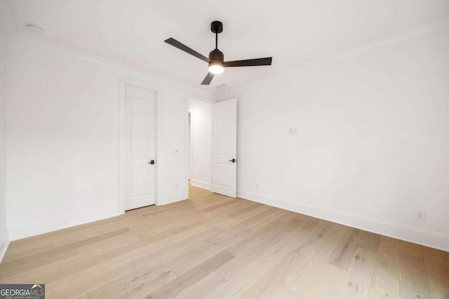 1050 Carnoustie, Greensboro, GA 30642 - unfurnished bedroom with light wood-style flooring, ornamental molding, and ceiling fan