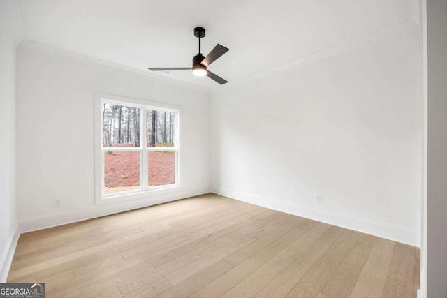 1050 Carnoustie, Greensboro, GA 30642 - spare room featuring crown molding, light wood finished floors, and ceiling fan