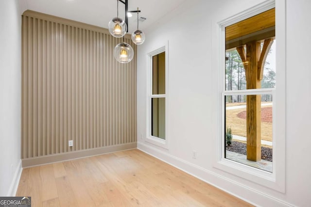 1050 Carnoustie, Greensboro, GA 30642 - unfurnished dining area with light wood-style floors and baseboards