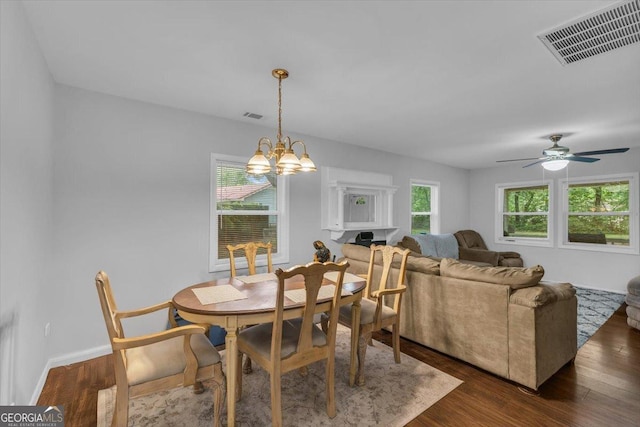342 Chevis Rd, Savannah, GA 31419 - dining area with a chandelier, dark wood-type flooring, a ceiling fan, and baseboards