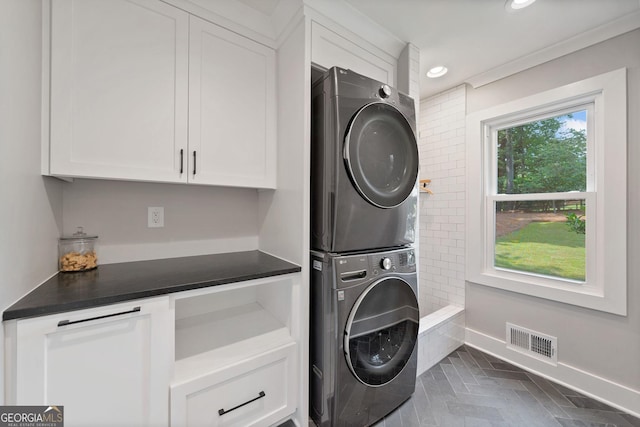 2885 Laurel Green Ct, Roswell, GA 30076 - washroom with stacked washer / dryer, cabinet space, baseboards, and recessed lighting