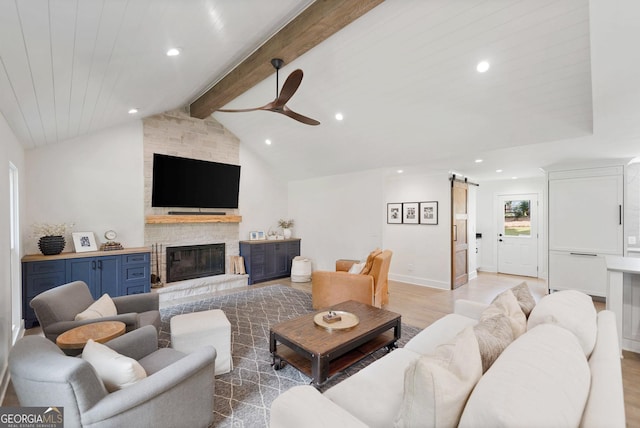2885 Laurel Green Ct, Roswell, GA 30076 - living area with a barn door, ceiling fan, recessed lighting, light wood-style floors, and a fireplace