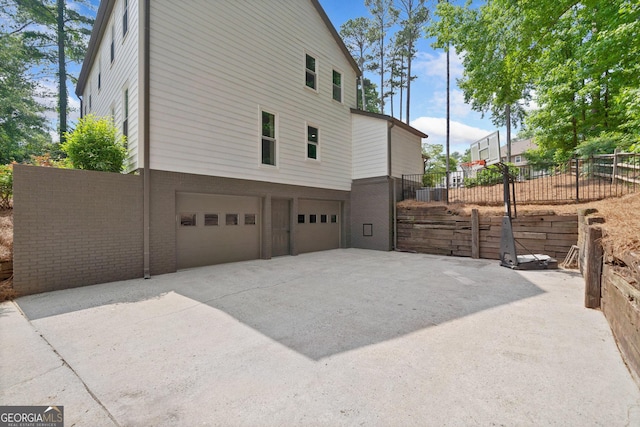 2885 Laurel Green Ct, Roswell, GA 30076 - view of side of home with a garage and concrete driveway