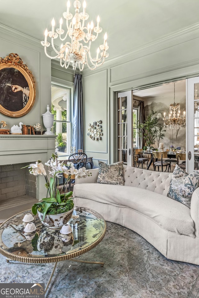 766 E Ave, Madison, GA 30650 - living area featuring a chandelier, ornamental molding, and a decorative wall