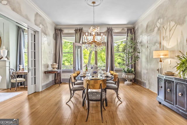 766 E Ave, Madison, GA 30650 - dining space with a chandelier, light wood finished floors, plenty of natural light, and ornamental molding