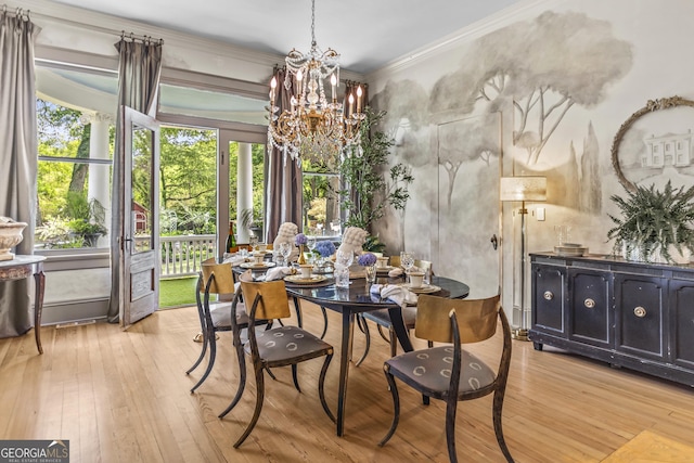 766 E Ave, Madison, GA 30650 - dining area with a chandelier, light wood-style floors, and ornamental molding