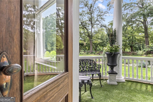 766 E Ave, Madison, GA 30650 - sunroom / solarium featuring view of wooded area