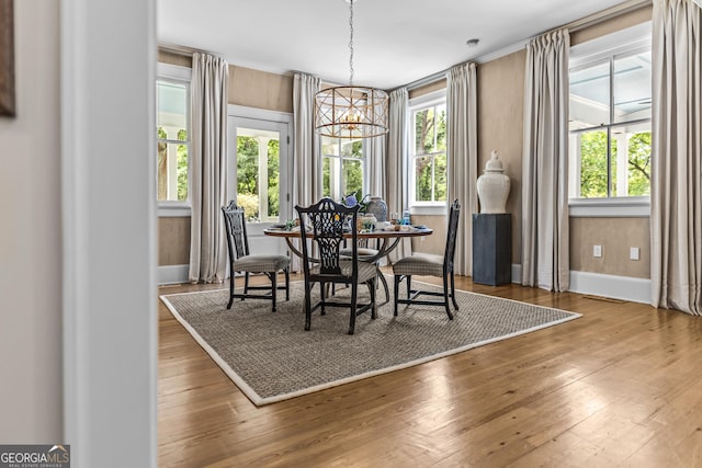 766 E Ave, Madison, GA 30650 - dining space with a chandelier, plenty of natural light, and wood-type flooring