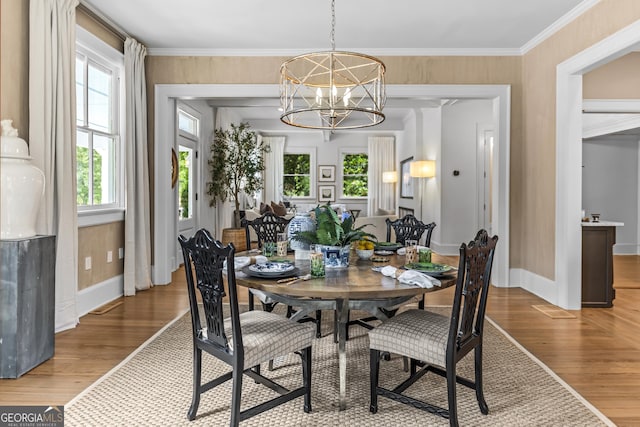 766 E Ave, Madison, GA 30650 - dining room with wood finished floors and a chandelier