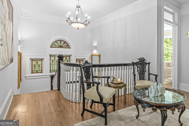 766 E Ave, Madison, GA 30650 - staircase featuring plenty of natural light, wood finished floors, a chandelier, and ornamental molding