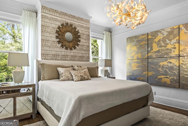 766 E Ave, Madison, GA 30650 - bedroom featuring ornamental molding, a chandelier, and wood finished floors