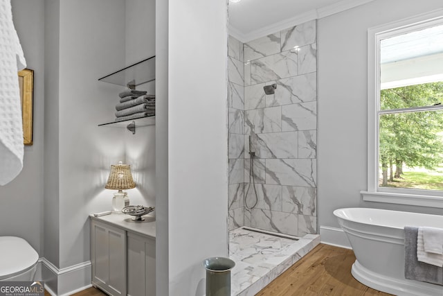 766 E Ave, Madison, GA 30650 - full bath with a stall shower, a soaking tub, ornamental molding, and wood finished floors