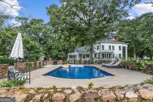 766 E Ave, Madison, GA 30650 - view of swimming pool featuring a patio area