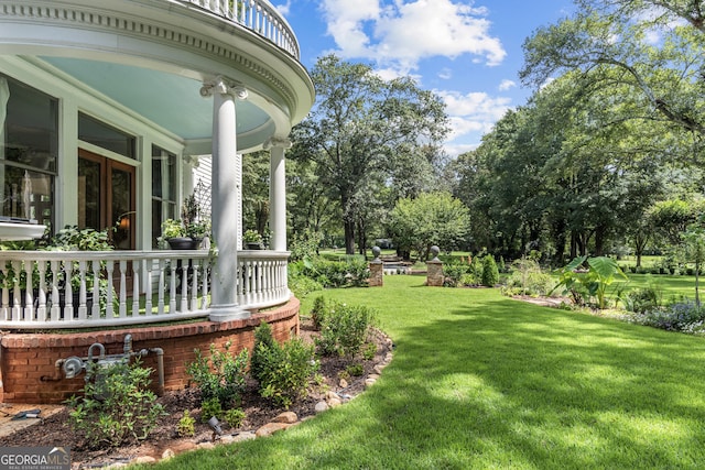 766 E Ave, Madison, GA 30650 - view of green lawn featuring a porch