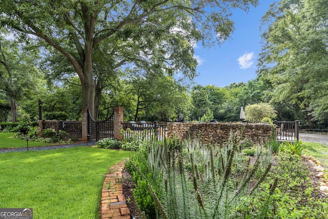 766 E Ave, Madison, GA 30650 - view of yard featuring a gate and view of scattered trees
