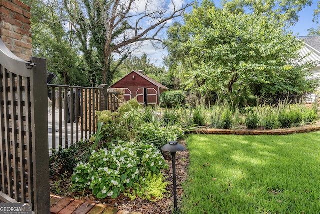 766 E Ave, Madison, GA 30650 - view of yard featuring a storage shed