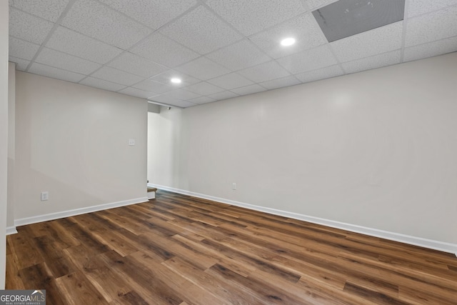 1124 Ponderosa Park Dr, Forest Park, GA 30297 - unfurnished room featuring dark wood finished floors, baseboards, recessed lighting, and a drop ceiling