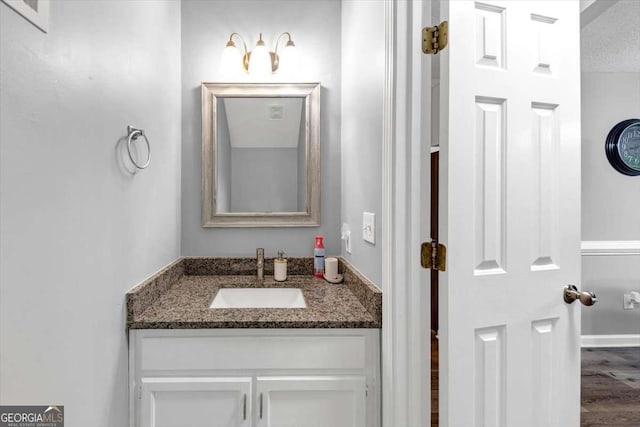 3190 Water Brook Dr SW, Conyers, GA 30094 - bathroom with vanity and wood finished floors