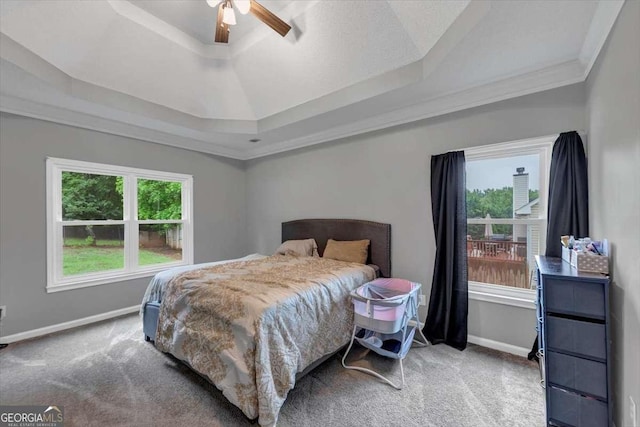 3190 Water Brook Dr SW, Conyers, GA 30094 - carpeted bedroom with a tray ceiling, baseboards, crown molding, and ceiling fan