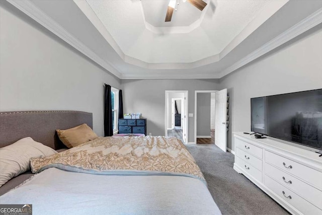 3190 Water Brook Dr SW, Conyers, GA 30094 - carpeted bedroom featuring a tray ceiling, a ceiling fan, ornamental molding, and baseboards
